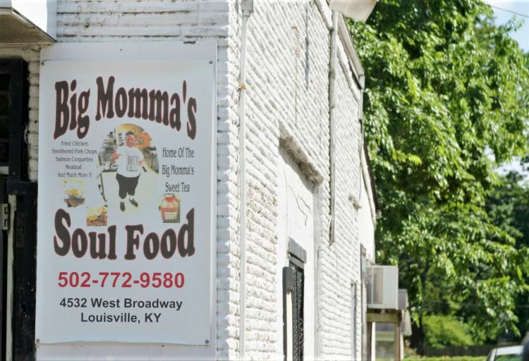 white brick exterior and restaurant sign for Big Momma's Soul Food in Louisville, KY