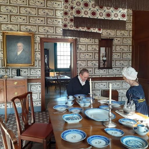 Locust Grove reenactors sit in the dining room.
