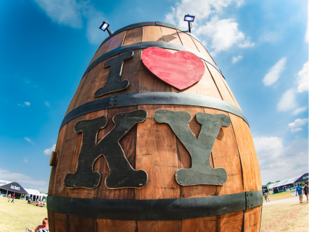 Fishbowl view of a larger-than-life bourbon barrel with "I love KY" written on the front at Bourbon & Beyond.