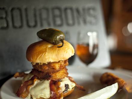 Burger topped with a jalapeno at Bourbons Bistro on the Urban Bourbon Trail