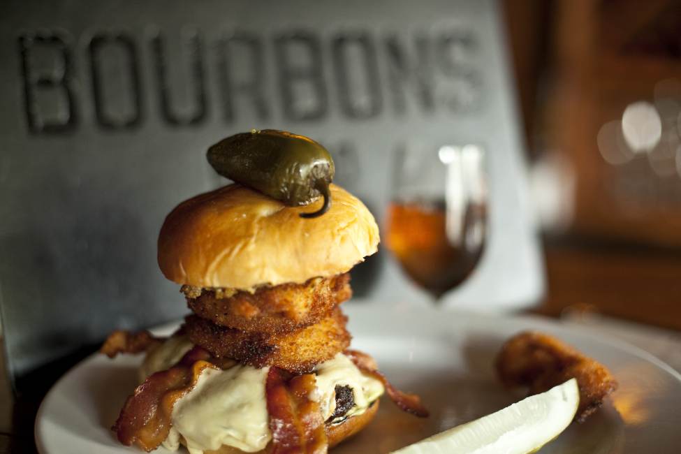 Burger topped with a jalapeno at Bourbons Bistro on the Urban Bourbon Trail