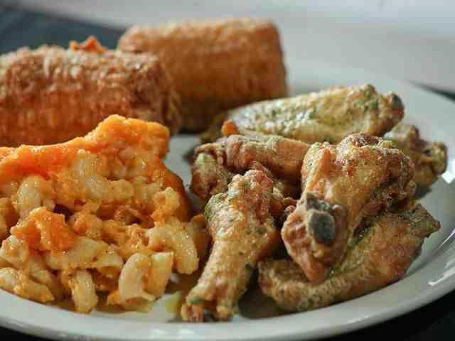 close-up of a platter of mac and cheese and wings from Dasha Barbours, a restaurant serving soul food in louisville, ky