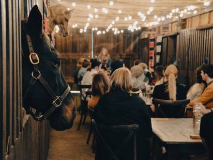 A bourbon tasting in a horse barn at Barn 6 at Hermitage Farm